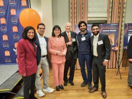 Group of computer science faculty smiling together at award ceremony event
